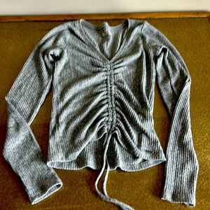 Hollister woman’s sz gray long sleeve top.  Drawstring front. V neck.